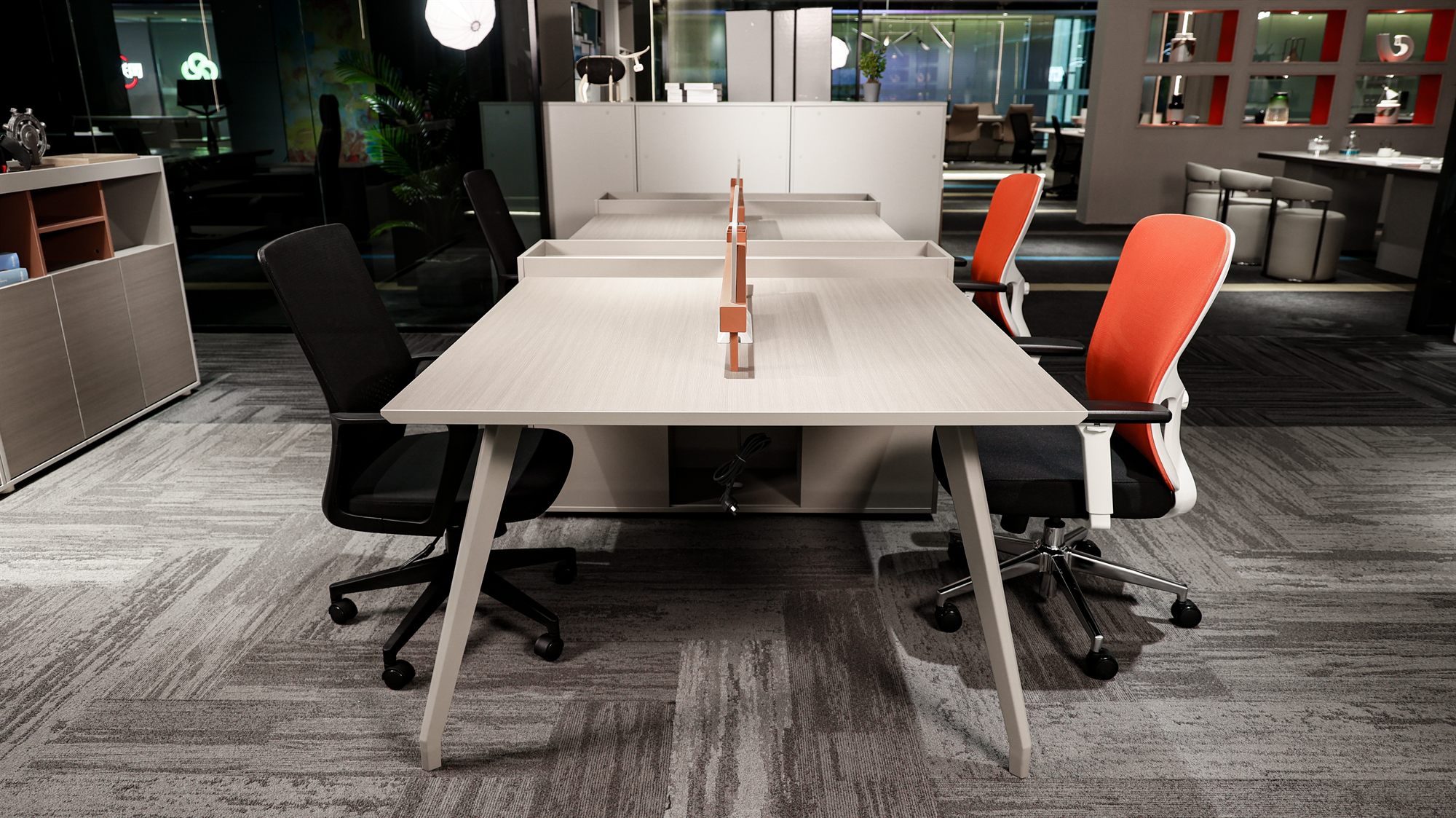 Open-plan benching with mesh task chairs